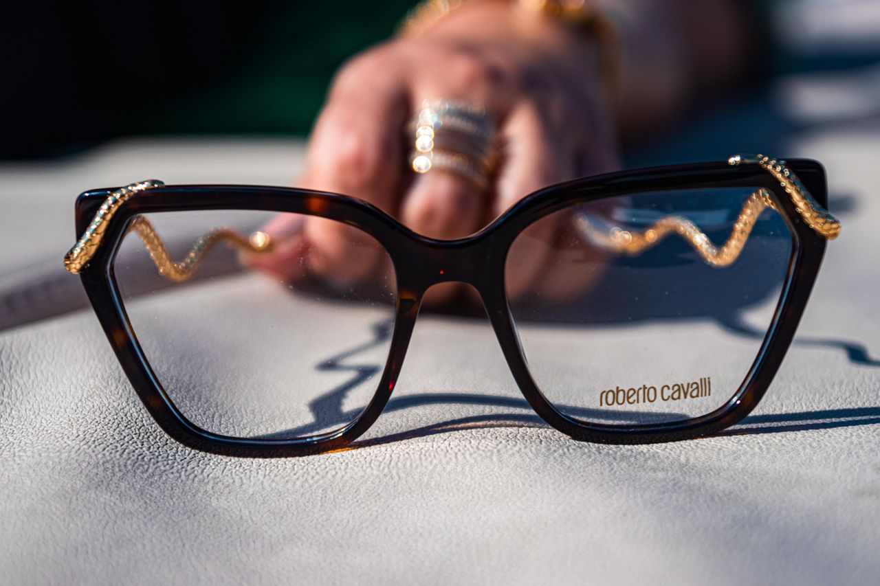 Crafting Captivating Headlines: Your awesome post title goes here Elegant Roberto Cavalli eyeglasses with intricate gold chain detail, captured in Portugal.
